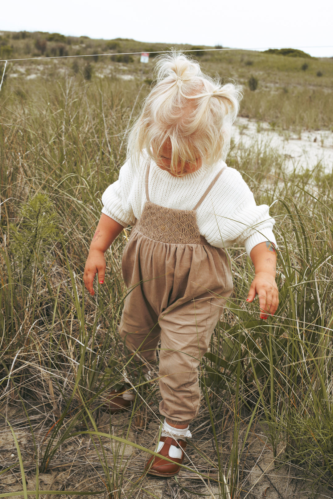 2512CA-BB GIRL ROMPER W SMOCKING-CAMEL