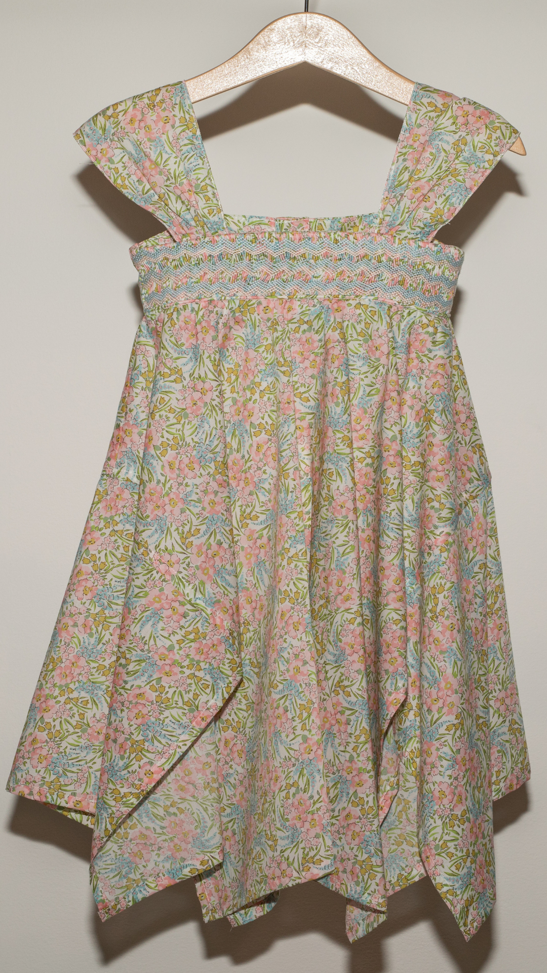 ASYMMETRIC STRAPPY HAND EMBROIDERED DRESS IN PINK LIBERTY FABRIC.