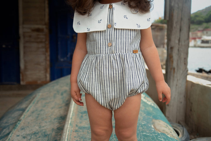 Mod.10.4 Embroidered striped romper suit with bib collar